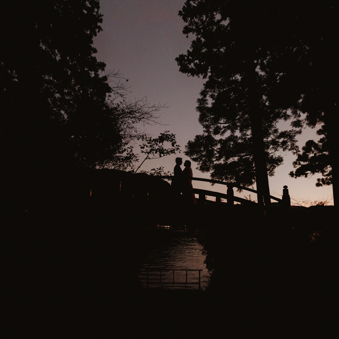 Hakone Elopement - Couple is looking each other on the bridge after sunset 