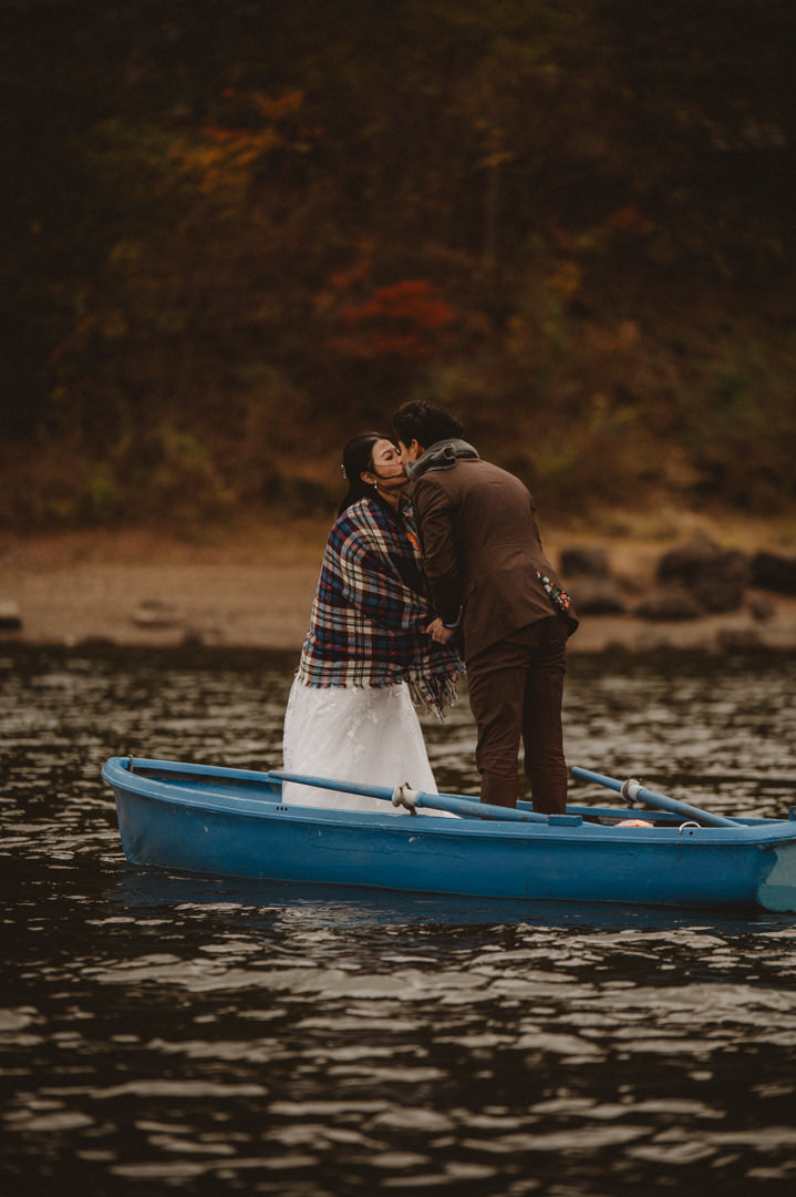 Japan Roadtrip Elopement- Kissing on the boat 