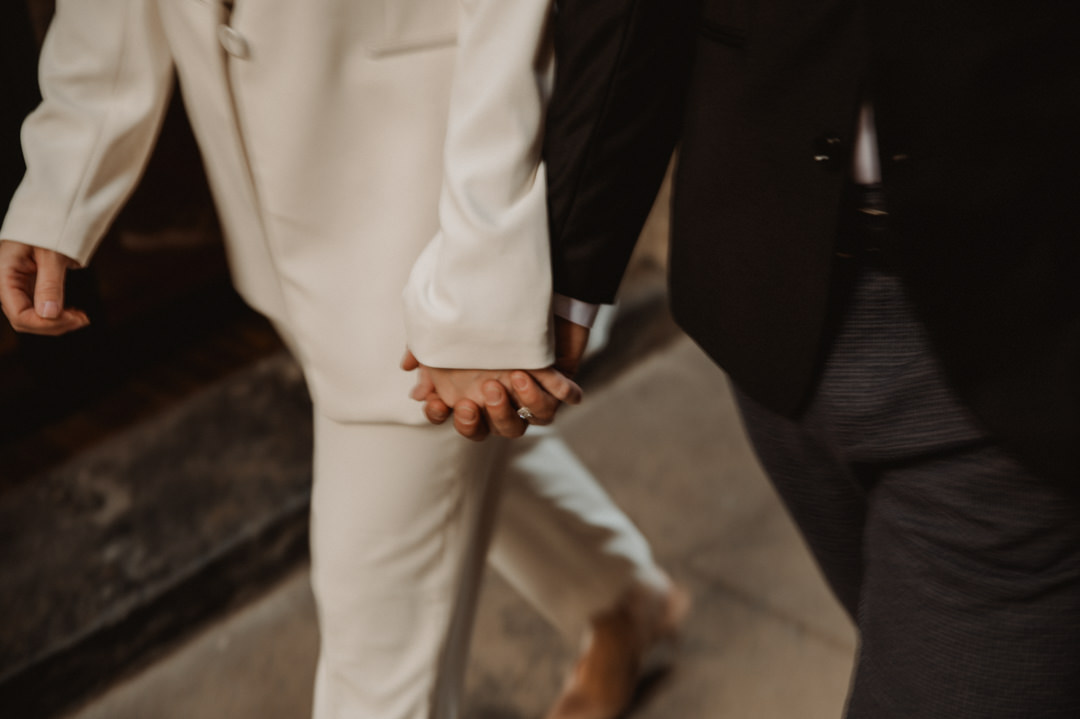 marimurtra elopement - couple exploring the city while holding their hands 