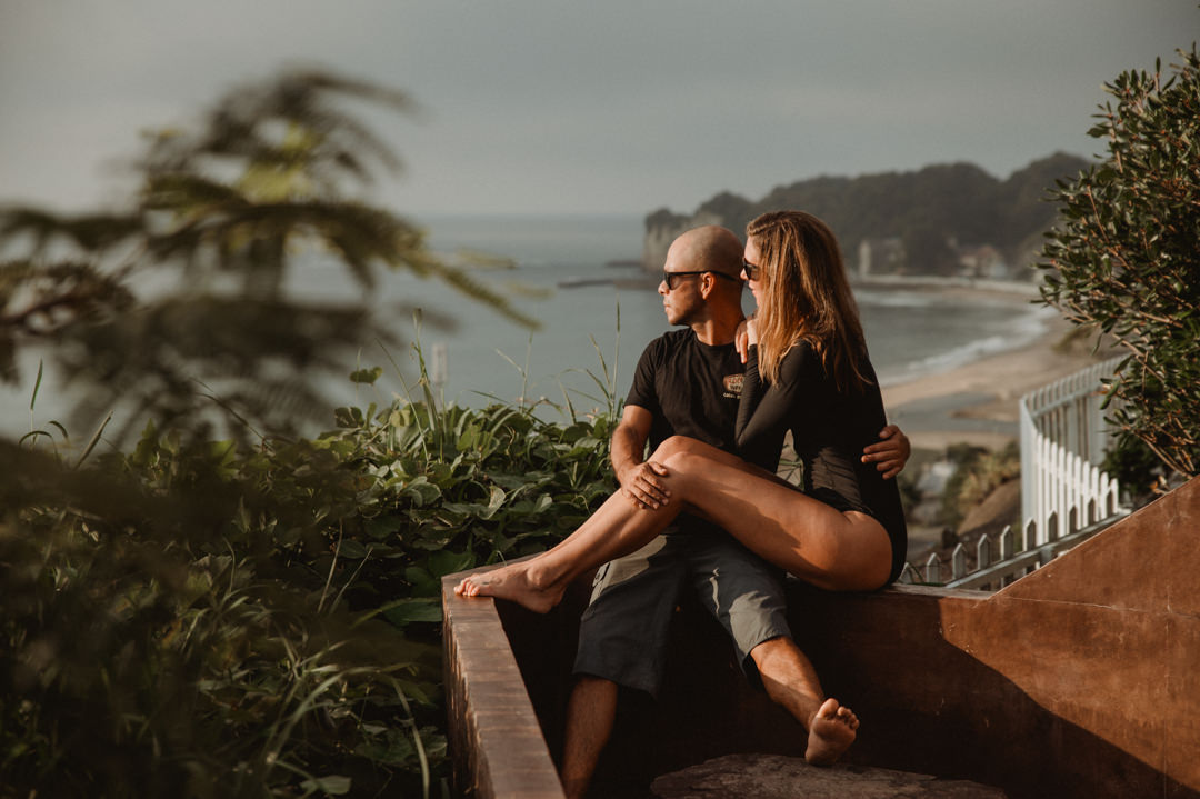 Surfer Elopement in Japan - Couple watching the sunrise at the rooftop