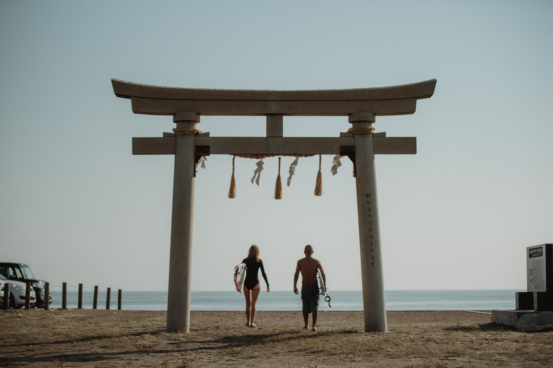 Surfer Elopement in Japan - Torii gate at the beach 
