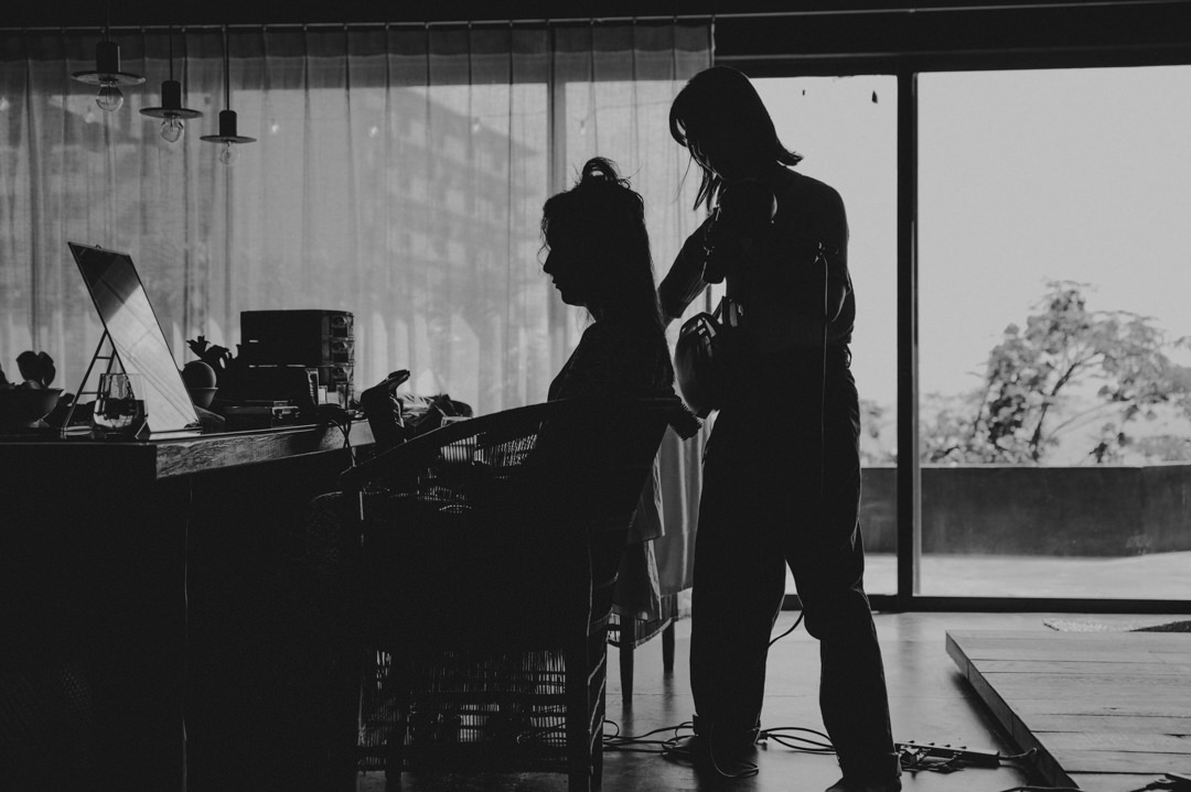 Surfer Elopement in Japan - bride getting ready by hair make up artist 