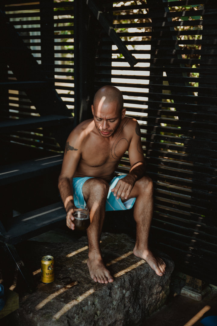 Surfer Elopement in Japan - Groom is having a cold beer to celebrate 