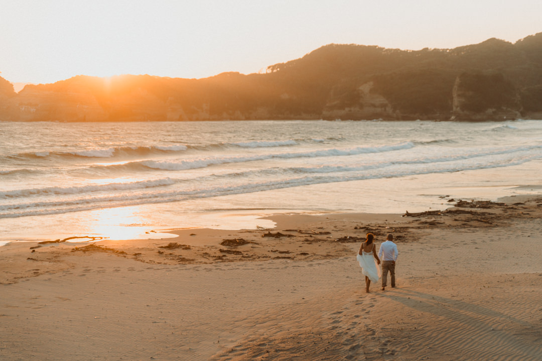 Surfer Elopement in Japan - Walking beach at sunset time 