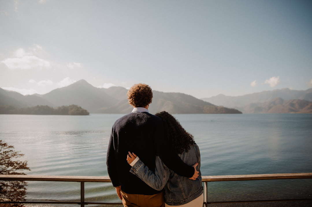 laid-back elopement in japan - couple looking over the lake 