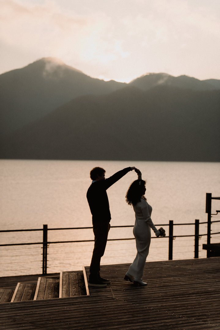 laid-back elopement in japan - couple dancing at the lake 