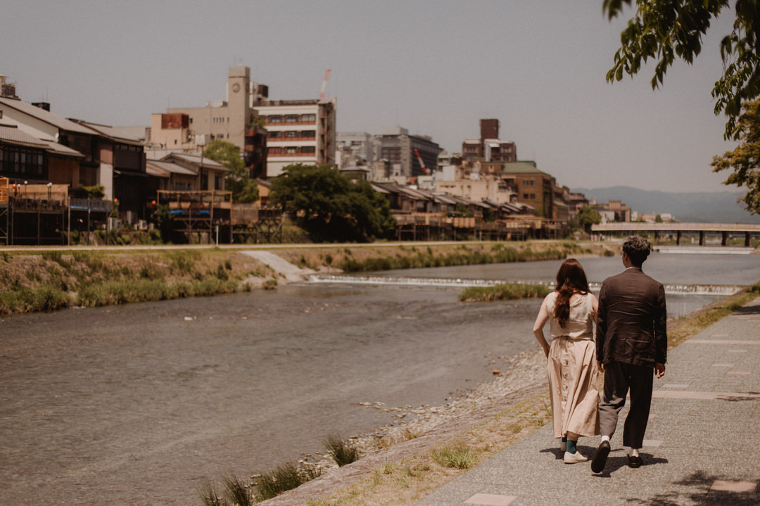 low-key elopement in japan - walking on the river 