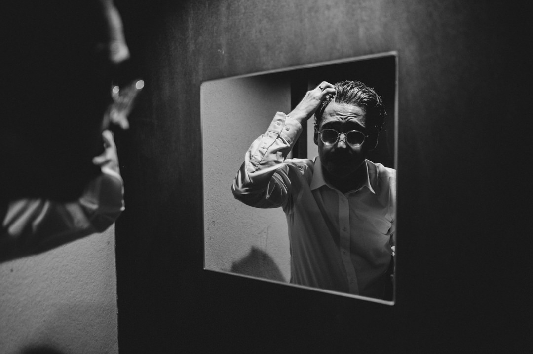 low-key elopement in japan - groom is setting his hair