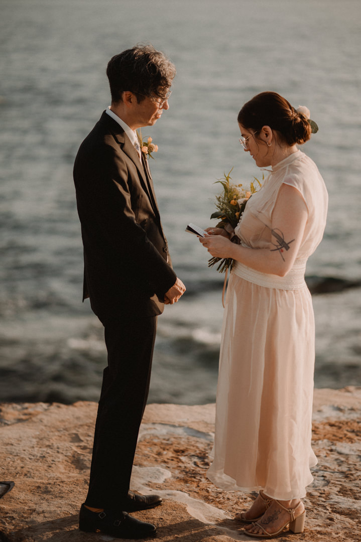 low-key elopement in japan - bride is reading her vows