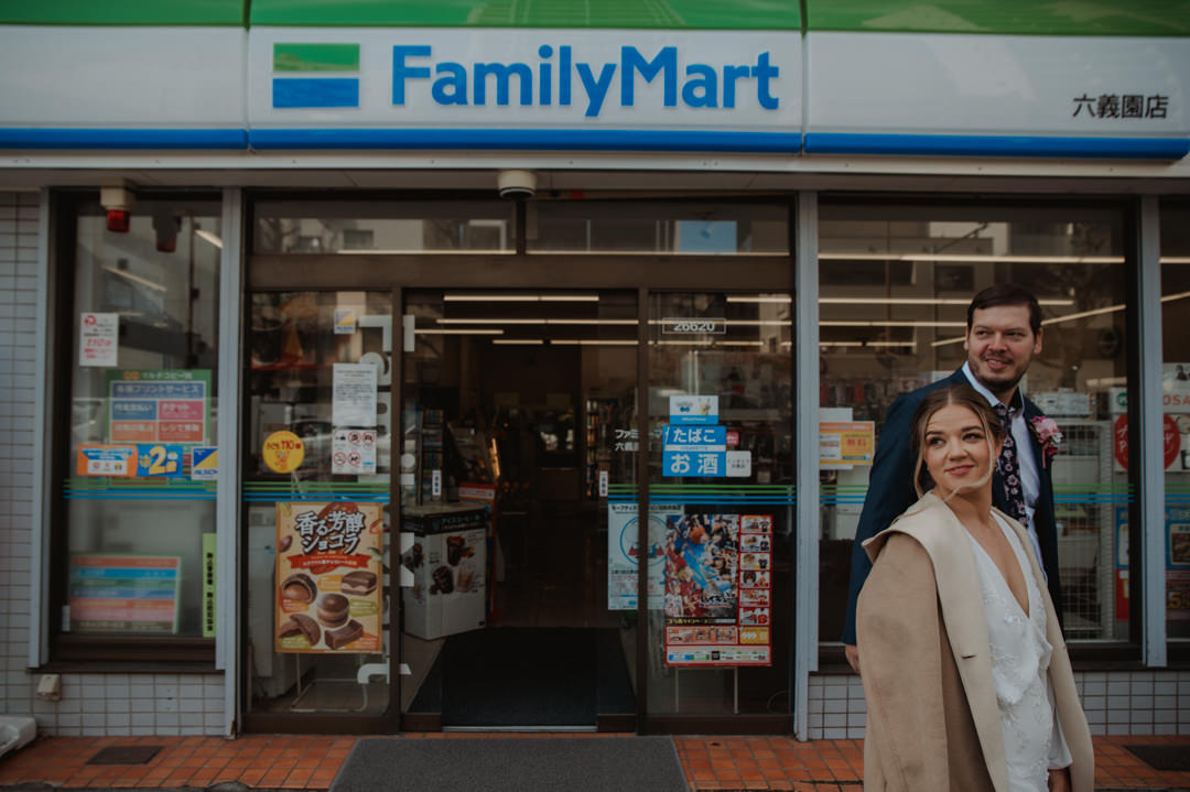 tokyo park elopement - photo in front of convenience store 