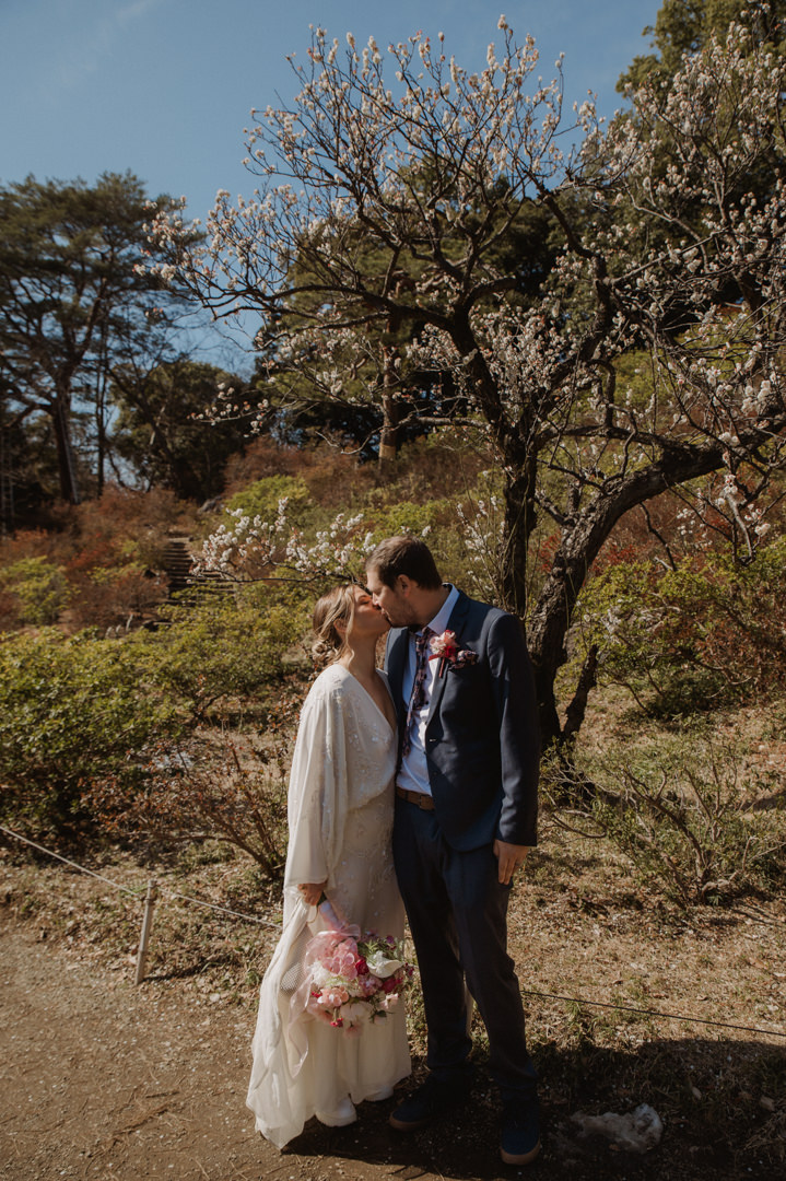 tokyo park elopement - kissing in front of ume tree