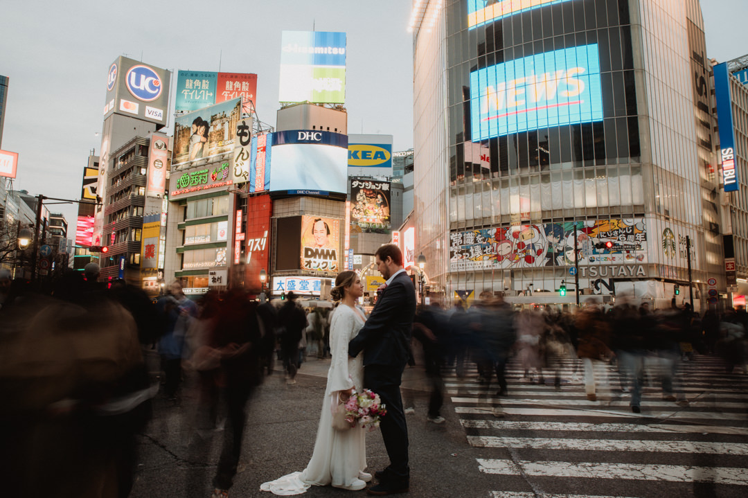 tokyo park elopement - couple standing middle of shibuya scramble crossing 