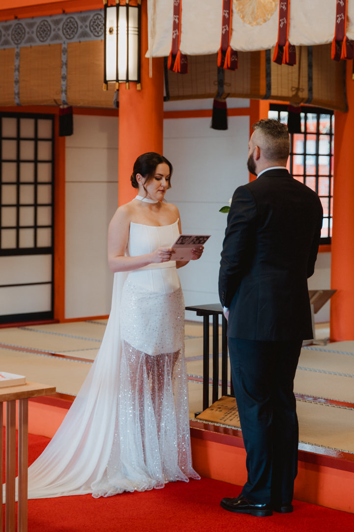 The couple exchanges their vows at a Shinto wedding ceremony.
Cherry blossom Elopement in Wakayama.