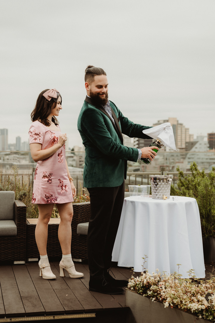 The couple have a toast with their guests, roof top elopement in Japan
