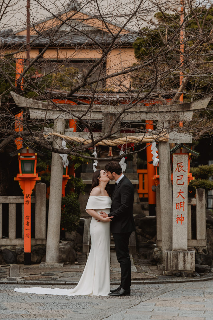 The couple explores Kyoto City. Snow Shrine Elopement in Japan